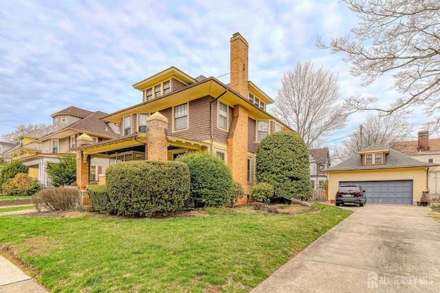 view of front of house with an outdoor structure, a chimney, a garage, and a front lawn