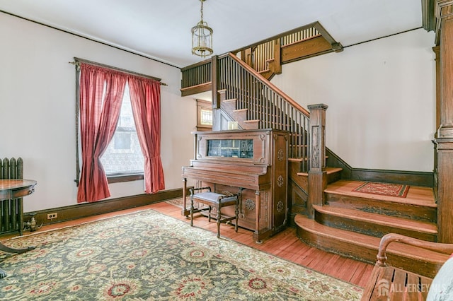 stairway with wood finished floors