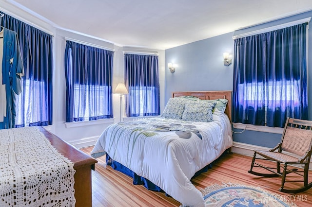 bedroom with wood finished floors