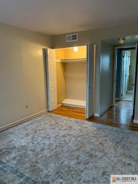47 Judson St Unit 14B, Edison, NJ 08837 - unfurnished bedroom with wood finished floors and a closet
