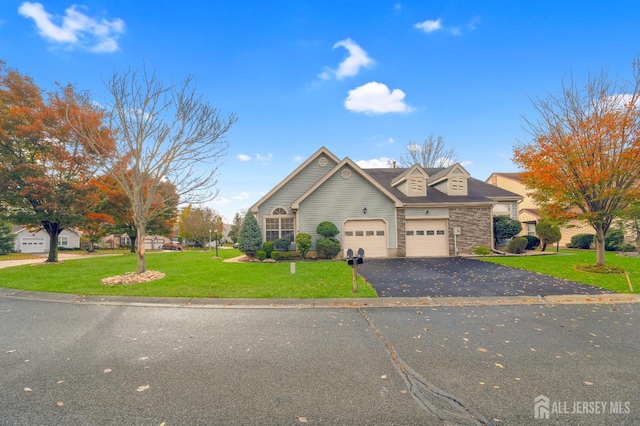 view of front property with a garage and a front lawn