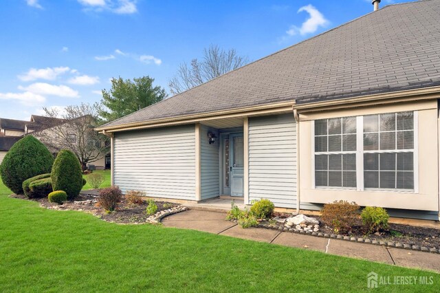 exterior space with a front lawn