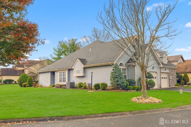 view of front facade with a garage and a front yard