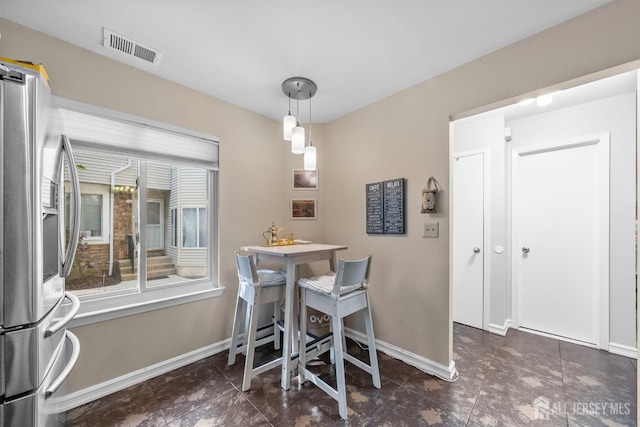 1058 Schmidt Ln, North Brunswick, NJ 08902 - tiled dining area with baseboards