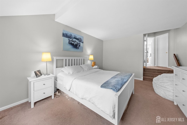 1058 Schmidt Ln, North Brunswick, NJ 08902 - bedroom featuring light colored carpet, baseboards, and lofted ceiling
