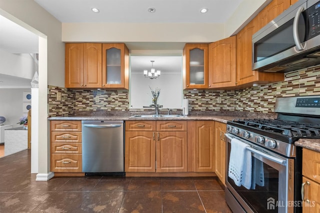 1058 Schmidt Ln, North Brunswick, NJ 08902 - kitchen with stainless steel appliances, a sink, glass insert cabinets, backsplash, and a chandelier