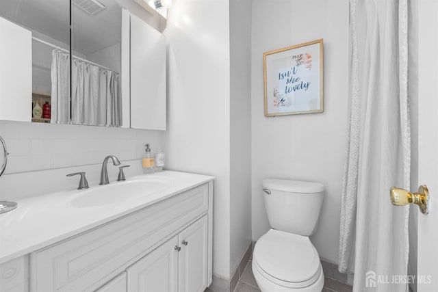 1058 Schmidt Ln, North Brunswick, NJ 08902 - bathroom featuring toilet, vanity, baseboards, and tile patterned flooring