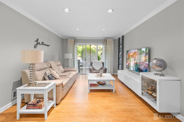 1058 Schmidt Ln, North Brunswick, NJ 08902 - living area with ornamental molding, recessed lighting, light wood-style flooring, and baseboards