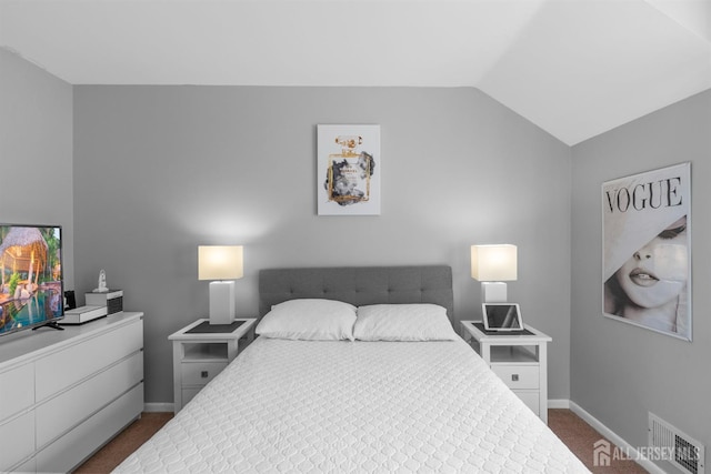 1058 Schmidt Ln, North Brunswick, NJ 08902 - bedroom with dark carpet, lofted ceiling, and baseboards