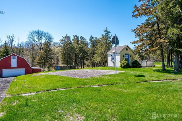 80 Gates Rd, Franklin Twsp, NJ 08873 - view of yard with an outdoor structure, driveway, a garage, and a barn