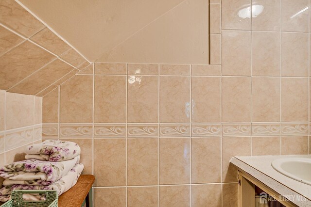 80 Gates Rd, Franklin Twsp, NJ 08873 - bathroom with lofted ceiling, vanity, and tile walls