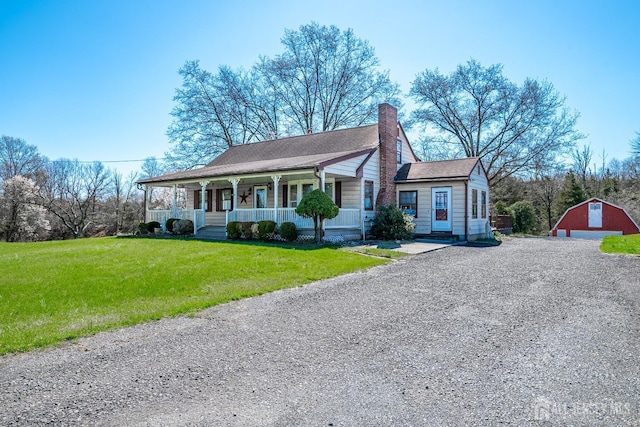 80 Gates Rd, Franklin Twsp, NJ 08873 - view of front facade with driveway, a chimney, an outbuilding, a porch, and a front lawn
