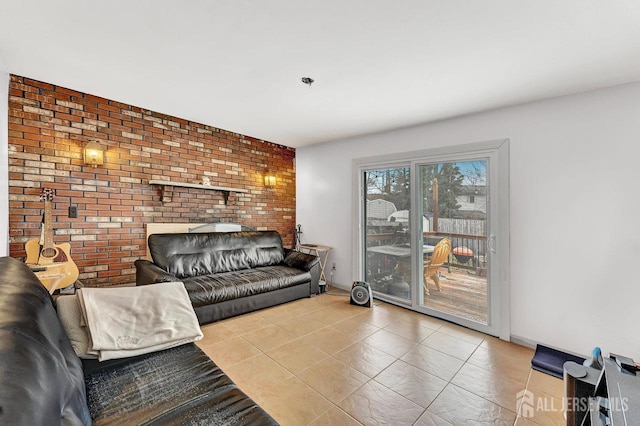 tiled living room featuring brick wall