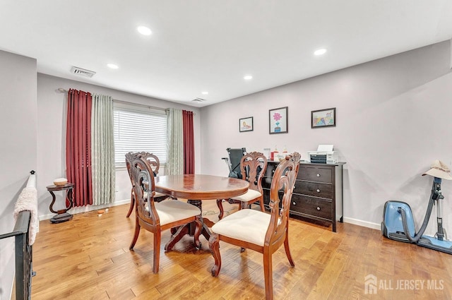 dining area with light wood-style flooring, visible vents, baseboards, and recessed lighting