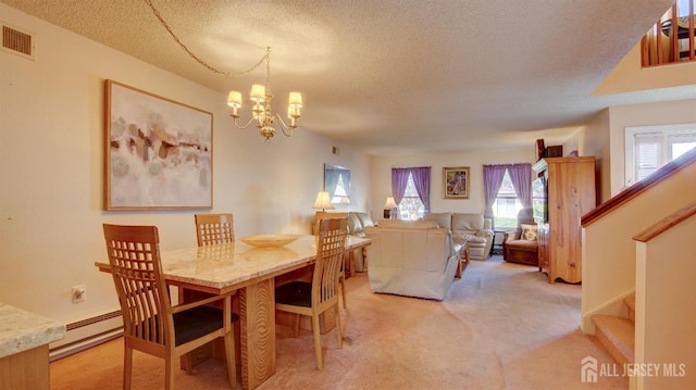 437 Belford Rd Unit B, Monroe, NJ 08831 - dining room featuring a textured ceiling, light carpet, baseboard heating, plenty of natural light, and a chandelier
