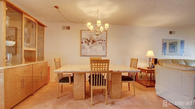 437 Belford Rd Unit B, Monroe, NJ 08831 - dining space with light carpet, a chandelier, and a textured ceiling