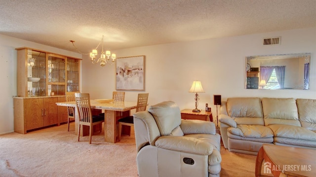 437 Belford Rd Unit B, Monroe, NJ 08831 - living area featuring a chandelier, a textured ceiling, and light carpet