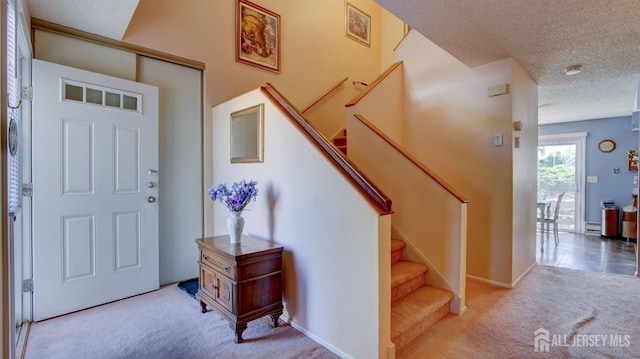 437 Belford Rd Unit B, Monroe, NJ 08831 - entrance foyer featuring carpet, a textured ceiling, and stairs