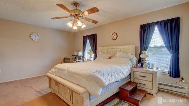 437 Belford Rd Unit B, Monroe, NJ 08831 - bedroom with light colored carpet, a baseboard radiator, a textured ceiling, a ceiling fan, and baseboards