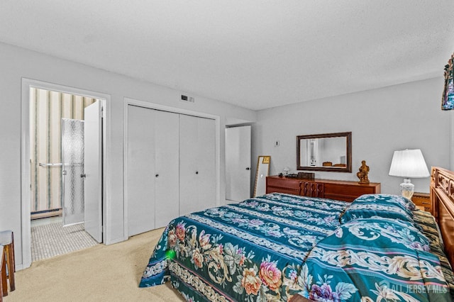 bedroom with a baseboard heating unit, connected bathroom, a textured ceiling, light carpet, and a closet