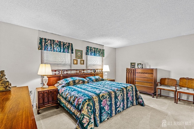 carpeted bedroom with a textured ceiling