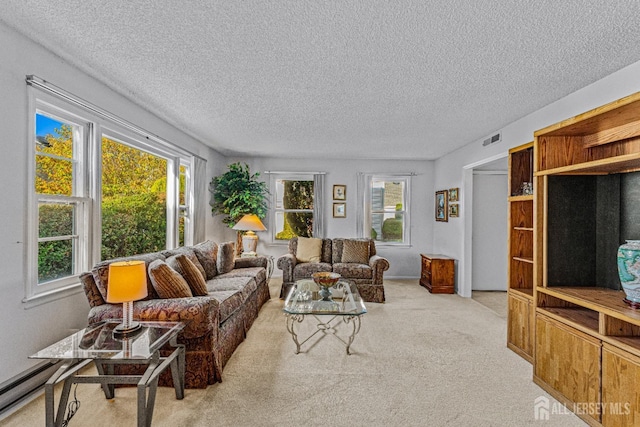 living room with light carpet and a textured ceiling