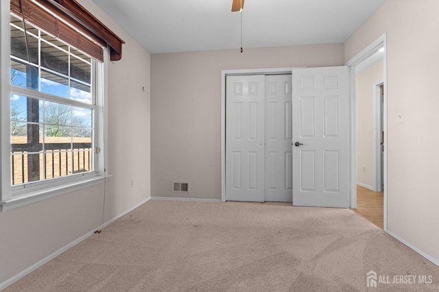 126 Concordia Cir Unit F, Monroe, NJ 08831 - unfurnished bedroom with visible vents, multiple windows, carpet floors, and baseboards