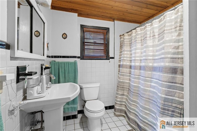 552 Parkview Ave, North Plainfield, NJ 07063 - full bathroom featuring wood ceiling, tile patterned floors, toilet, tile walls, and a shower with shower curtain