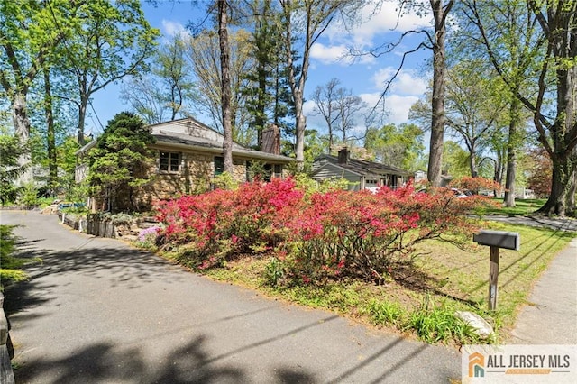 552 Parkview Ave, North Plainfield, NJ 07063 - view of front of property with a chimney and stone siding