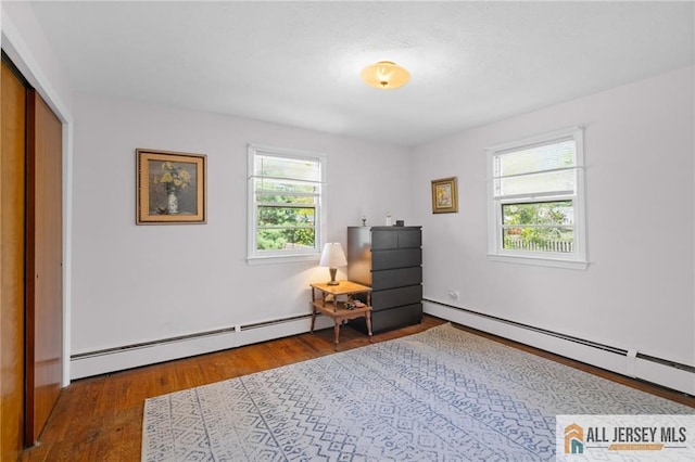 552 Parkview Ave, North Plainfield, NJ 07063 - sitting room with baseboard heating and wood finished floors
