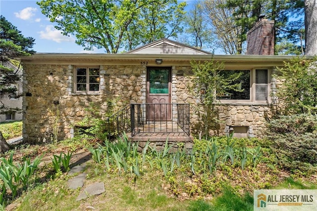 552 Parkview Ave, North Plainfield, NJ 07063 - view of front of house featuring stone siding and a chimney