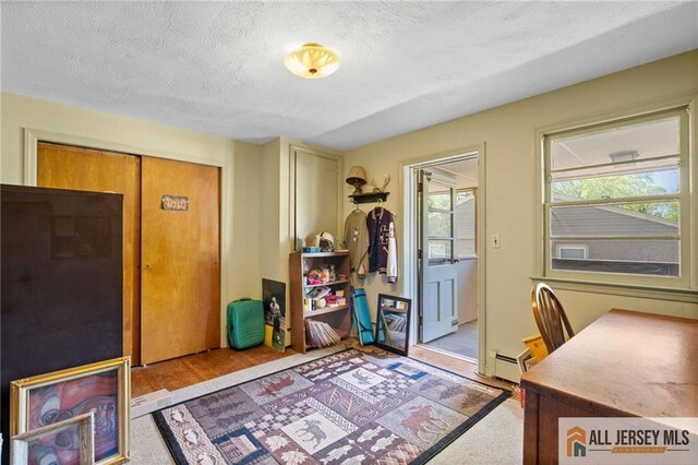 552 Parkview Ave, North Plainfield, NJ 07063 - home office featuring a baseboard heating unit and a textured ceiling