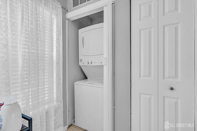 2207 Timber Ridge Ct, Sayreville, NJ 08859 - laundry room featuring estacked washer and dryer