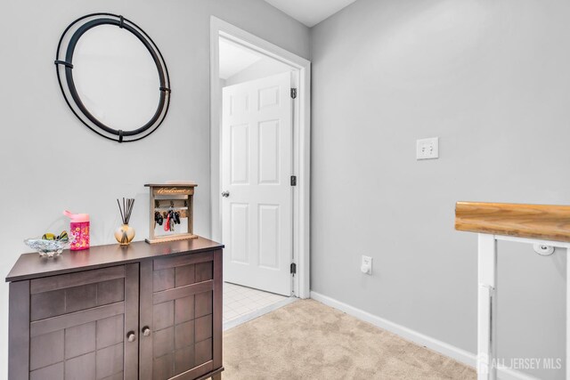 2207 Timber Ridge Ct, Sayreville, NJ 08859 - hallway with light colored carpet and baseboards