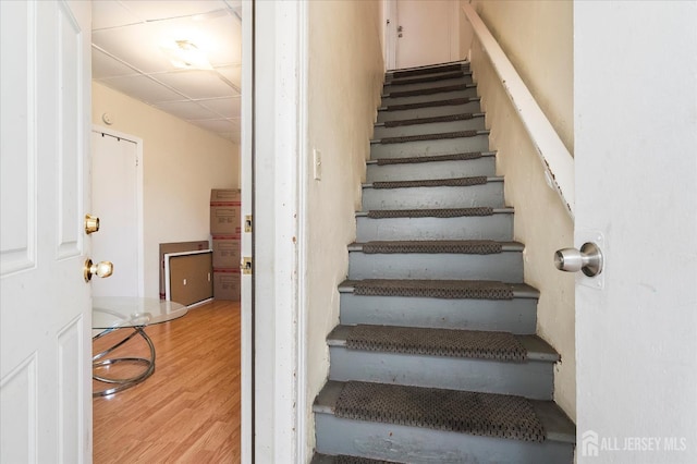 719 Catherine St, Perth Amboy, NJ 08861 - stairs with wood finished floors and a drop ceiling