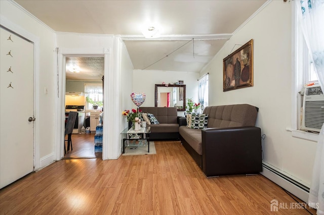 719 Catherine St, Perth Amboy, NJ 08861 - living room with a baseboard heating unit, plenty of natural light, and light wood-style flooring
