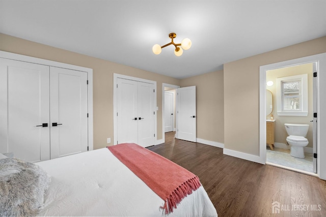 344 W Point Ave W, Franklin Twsp, NJ 08873 - bedroom featuring connected bathroom, baseboards, multiple closets, and dark wood finished floors