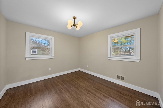 344 W Point Ave W, Franklin Twsp, NJ 08873 - spare room with dark wood-style flooring, a chandelier, baseboards, and visible vents