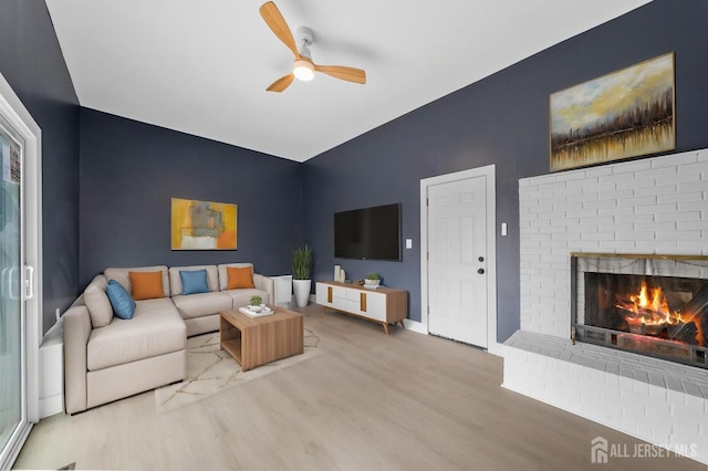 344 W Point Ave W, Franklin Twsp, NJ 08873 - living room featuring baseboards, a ceiling fan, wood finished floors, and a brick fireplace