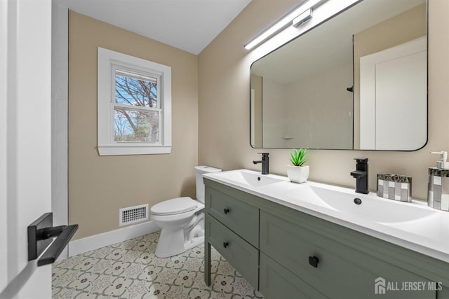 344 W Point Ave W, Franklin Twsp, NJ 08873 - bathroom featuring a sink, baseboards, toilet, and visible vents