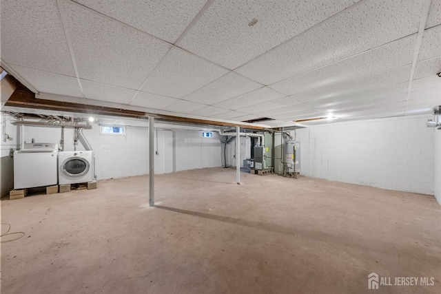 344 W Point Ave W, Franklin Twsp, NJ 08873 - below grade area with washing machine and clothes dryer, concrete block wall, a paneled ceiling, and water heater