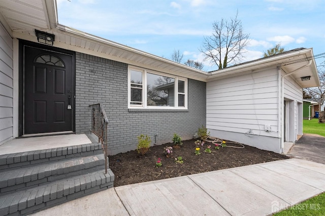 344 W Point Ave W, Franklin Twsp, NJ 08873 - entrance to property featuring brick siding and an attached garage