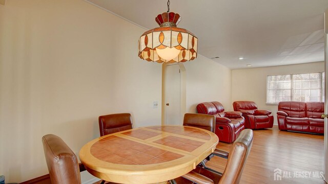 dining area with hardwood / wood-style floors