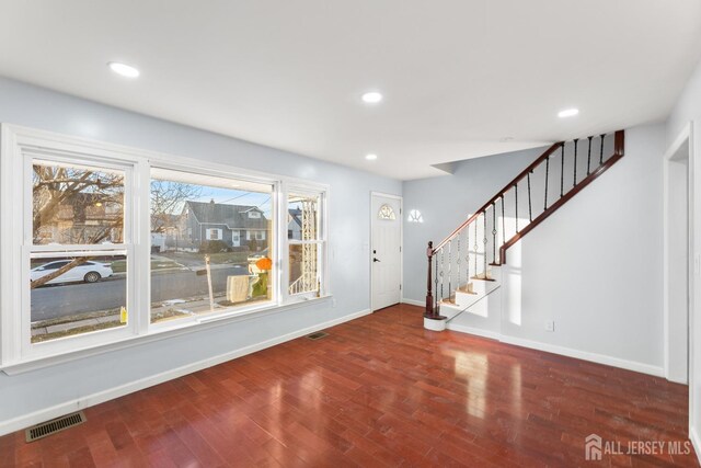 entrance foyer featuring dark hardwood / wood-style flooring