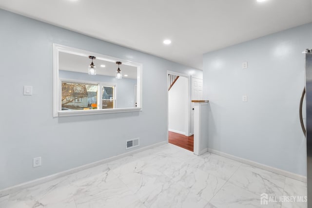 unfurnished room featuring recessed lighting, visible vents, marble finish floor, and baseboards