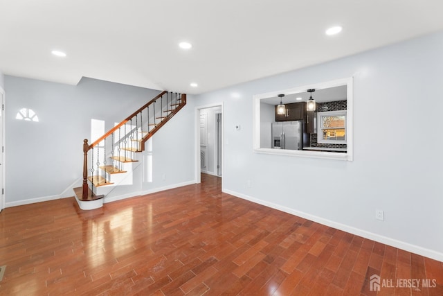 unfurnished living room featuring hardwood / wood-style floors