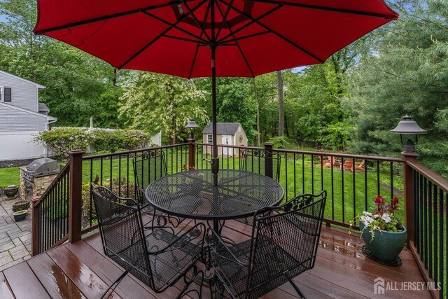 14 Bonnie Brook Ter, Middlesex, NJ 08846 - wooden deck with outdoor dining area, a yard, view of scattered trees, and grilling area
