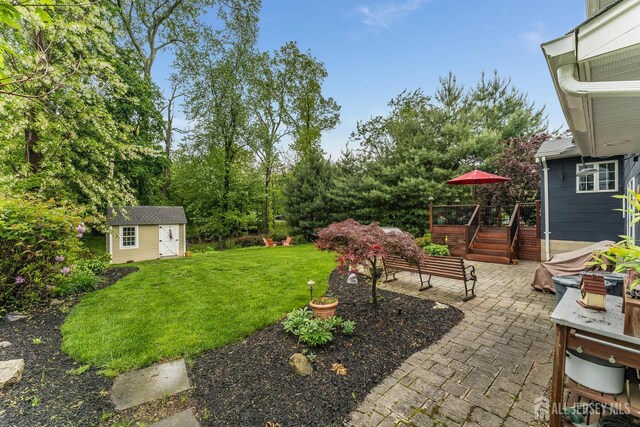 14 Bonnie Brook Ter, Middlesex, NJ 08846 - view of green lawn with a patio area and a deck