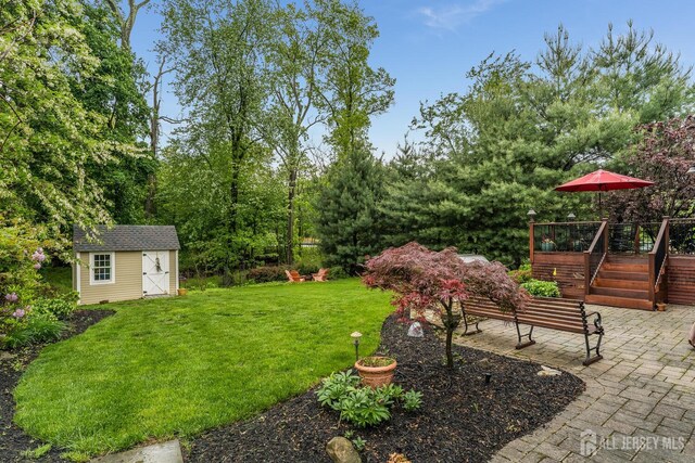 14 Bonnie Brook Ter, Middlesex, NJ 08846 - view of green lawn with a patio area and a wooden deck