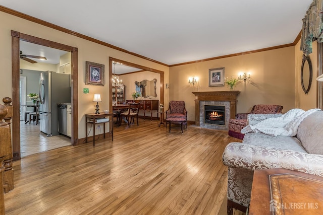 14 Bonnie Brook Ter, Middlesex, NJ 08846 - living area featuring light wood-style flooring, a fireplace, crown molding, and baseboards